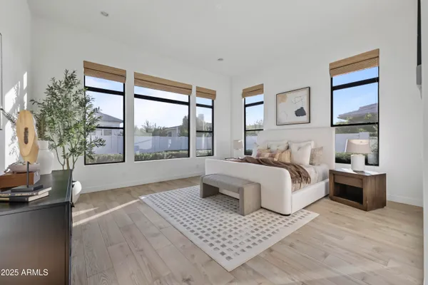 a spacious bedroom with a large bed and a couch