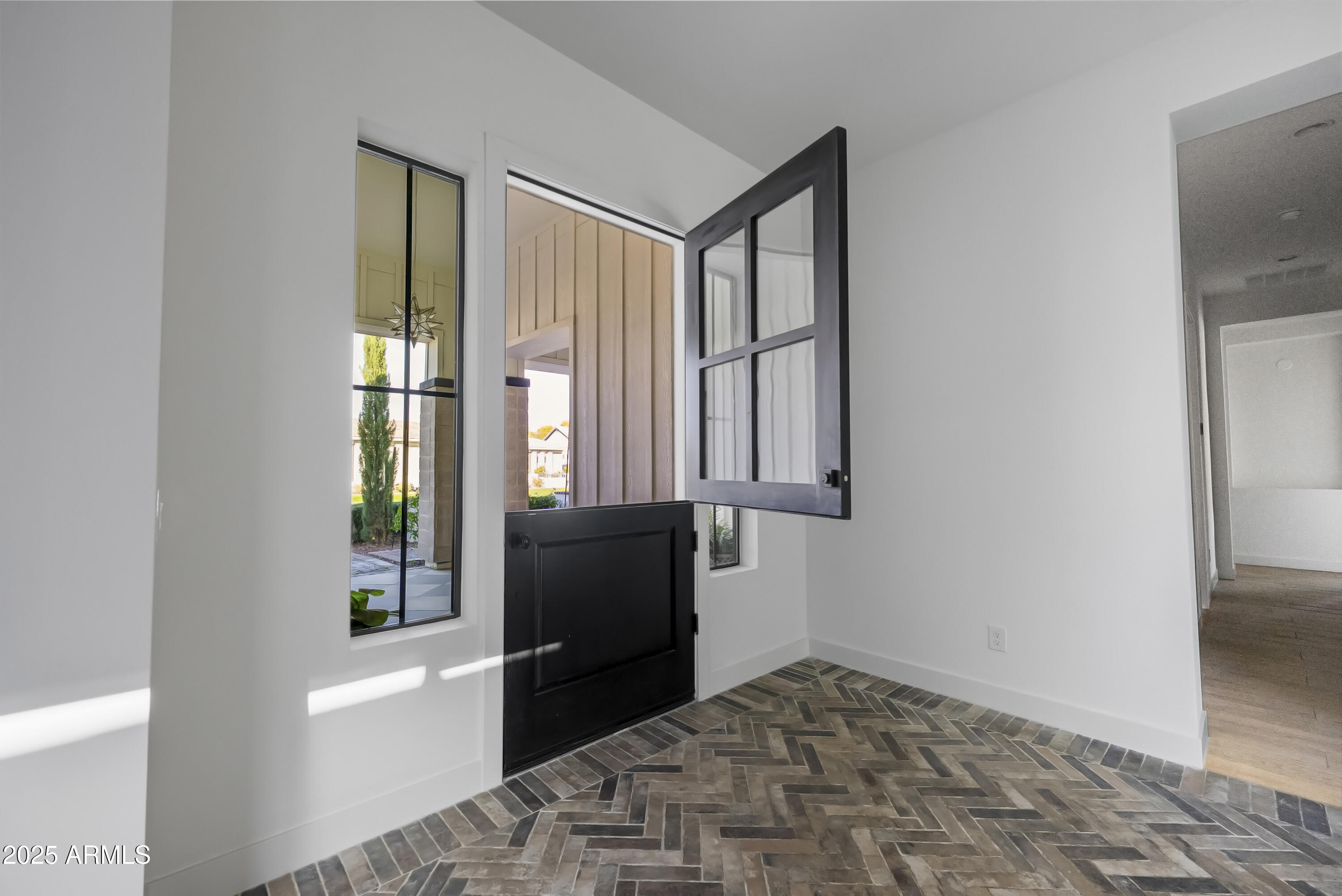 2753 East Hummingbird Way Gilbert, AZ 85297 - Photo 21 of 44 a view of a bedroom with wooden floor and a window
