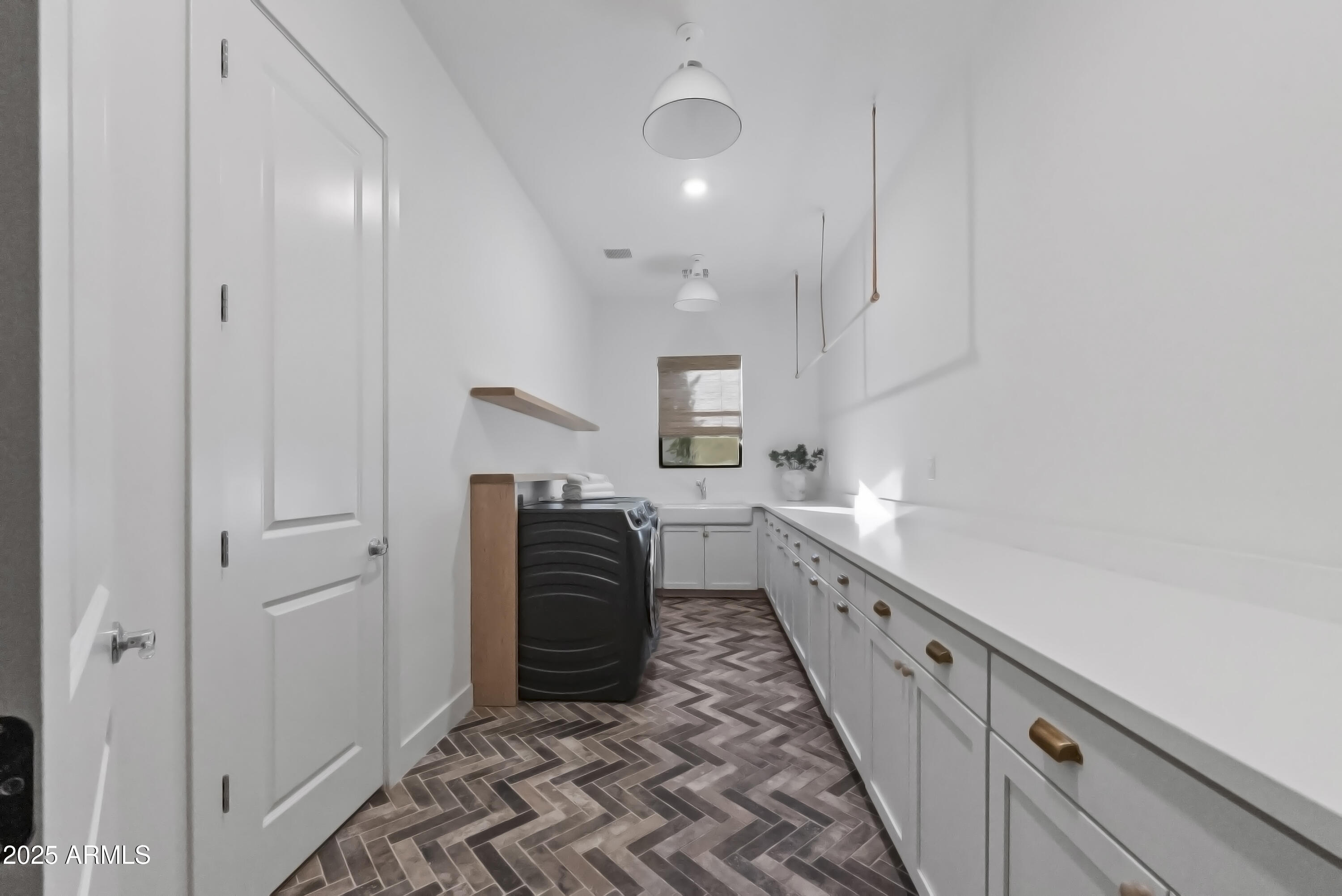 2753 East Hummingbird Way Gilbert, AZ 85297 - Photo 21 of 44 a kitchen with sink cabinets and stainless steel appliances