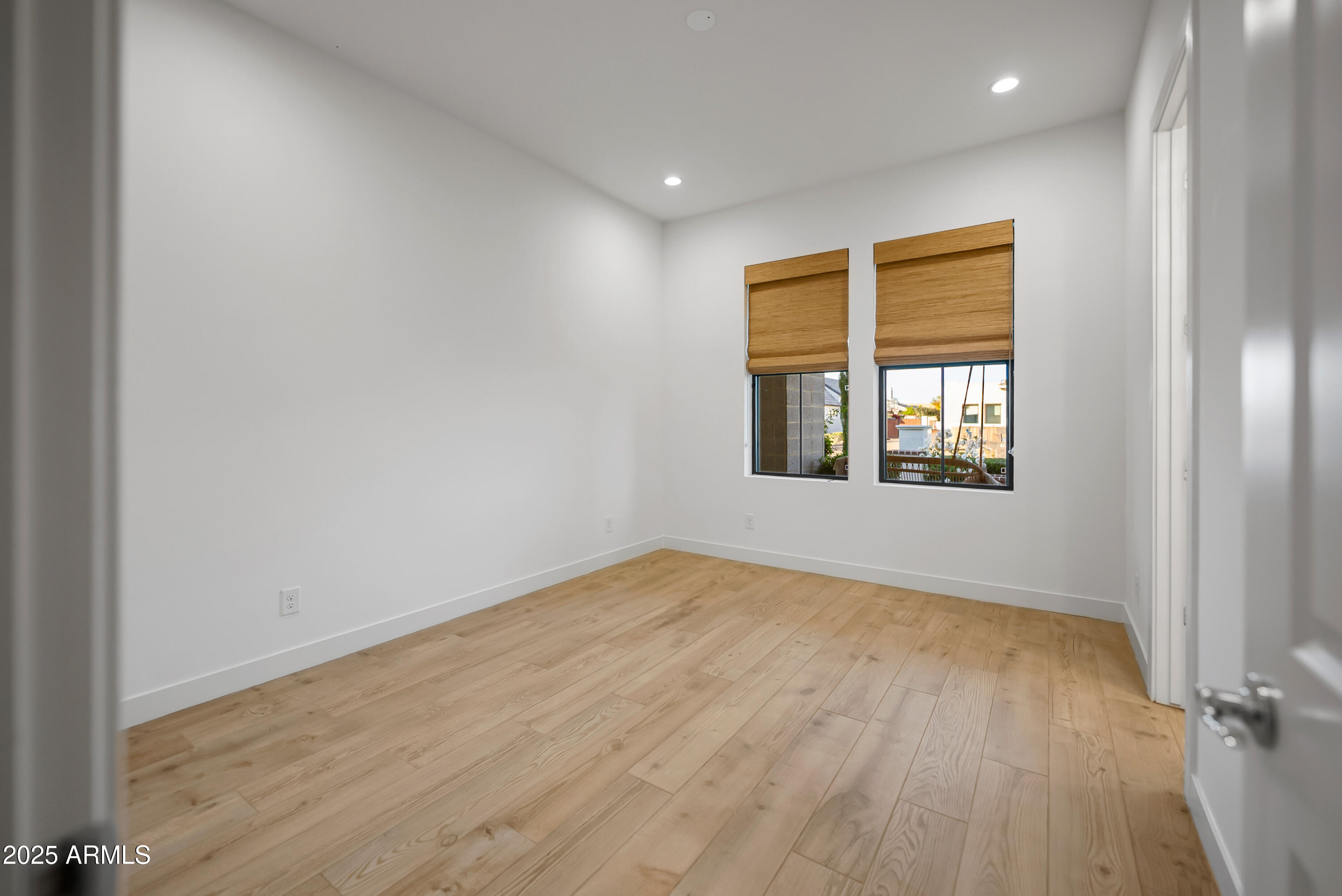 2753 East Hummingbird Way Gilbert, AZ 85297 - Photo 23 of 44 a view of empty room with wooden floor and fan