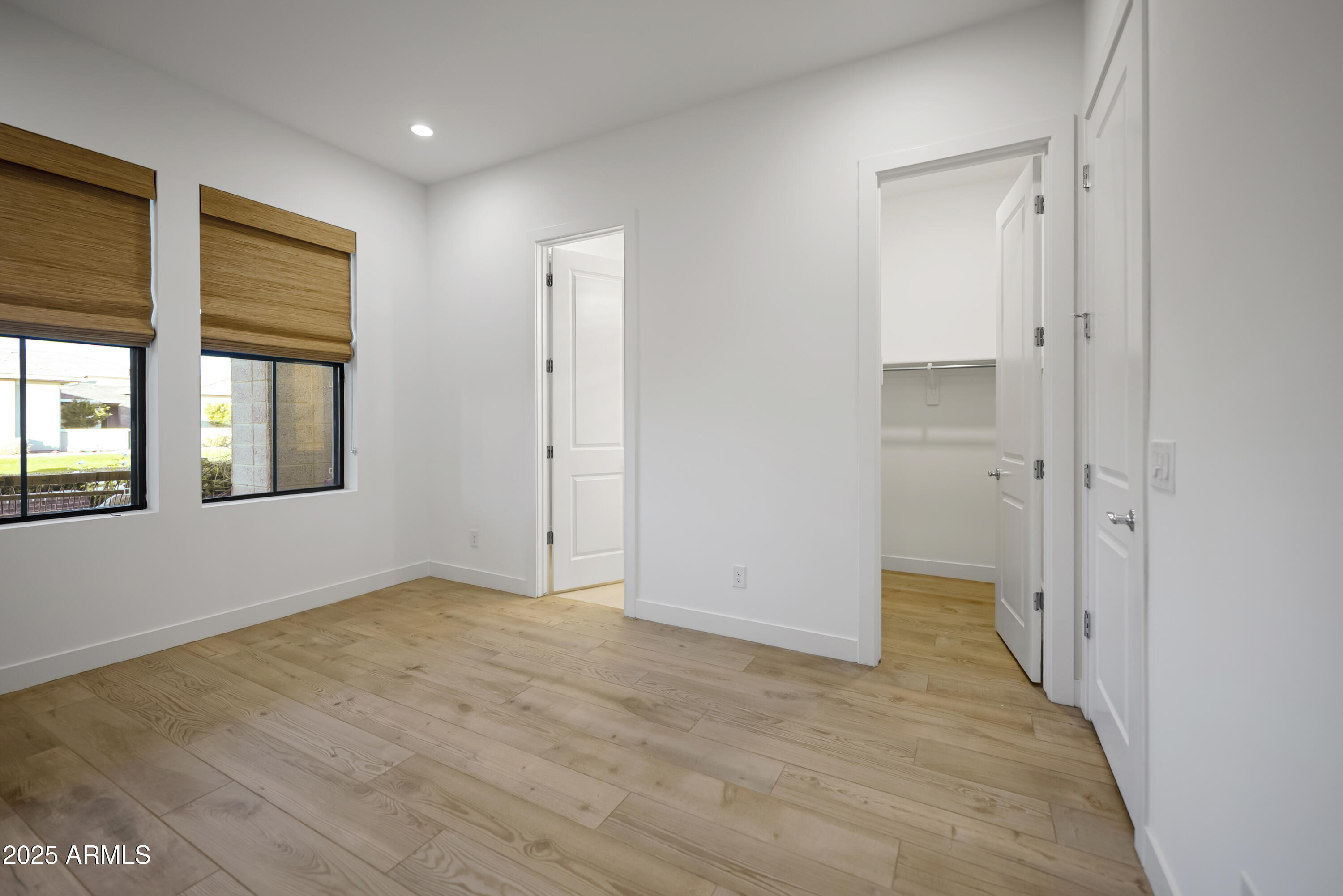 2753 East Hummingbird Way Gilbert, AZ 85297 - Photo 24 of 44 wooden floor in an empty room with a window