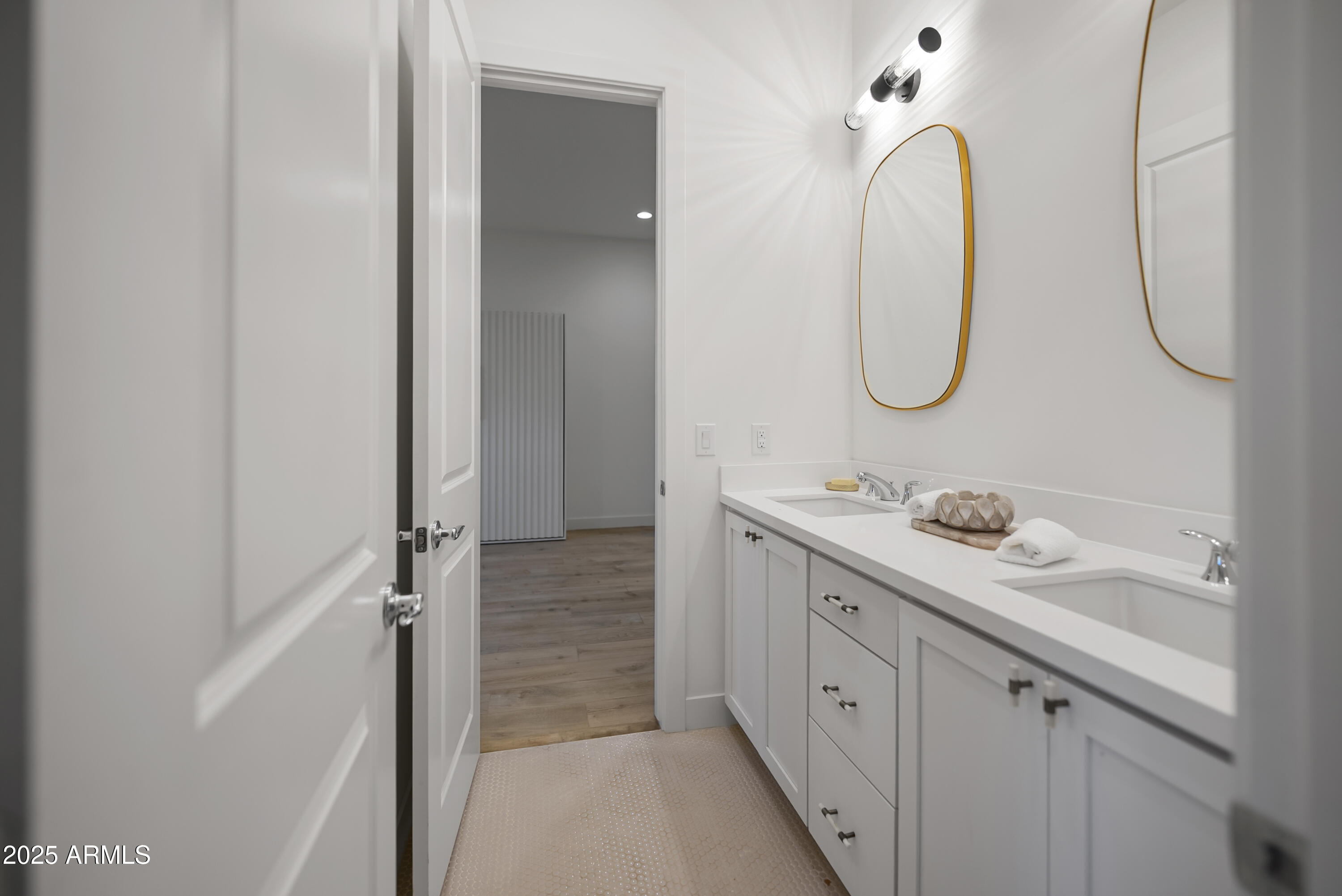 2753 East Hummingbird Way Gilbert, AZ 85297 - Photo 24 of 44 a spacious bathroom with a double vanity sink a mirror and a shower