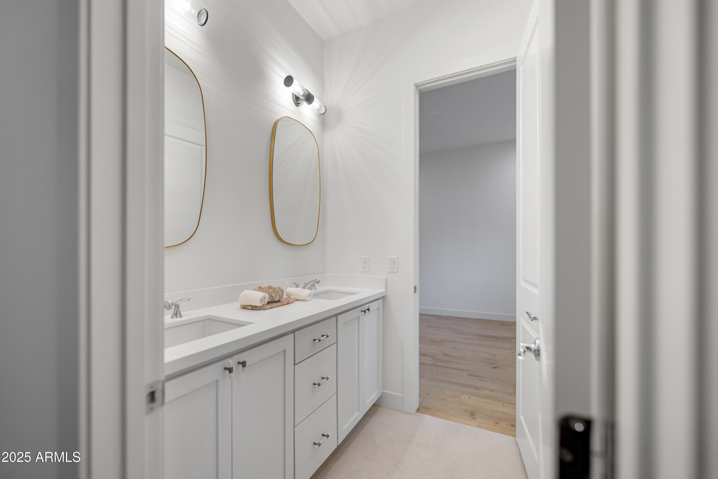 2753 East Hummingbird Way Gilbert, AZ 85297 - Photo 28 of 44 a bathroom with a double vanity sink mirror and a