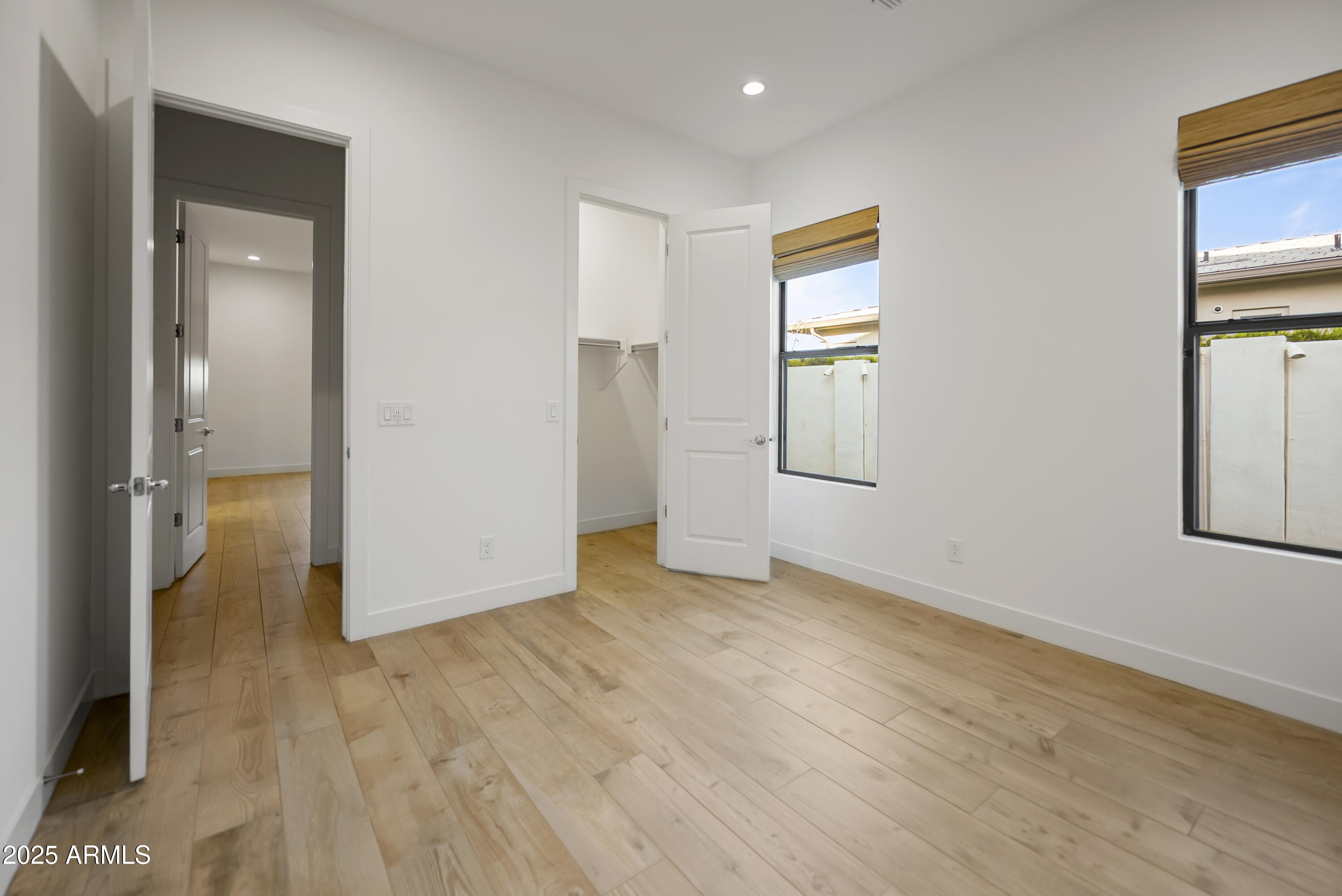 2753 East Hummingbird Way Gilbert, AZ 85297 - Photo 30 of 44 a view of empty room with wooden floor and fan