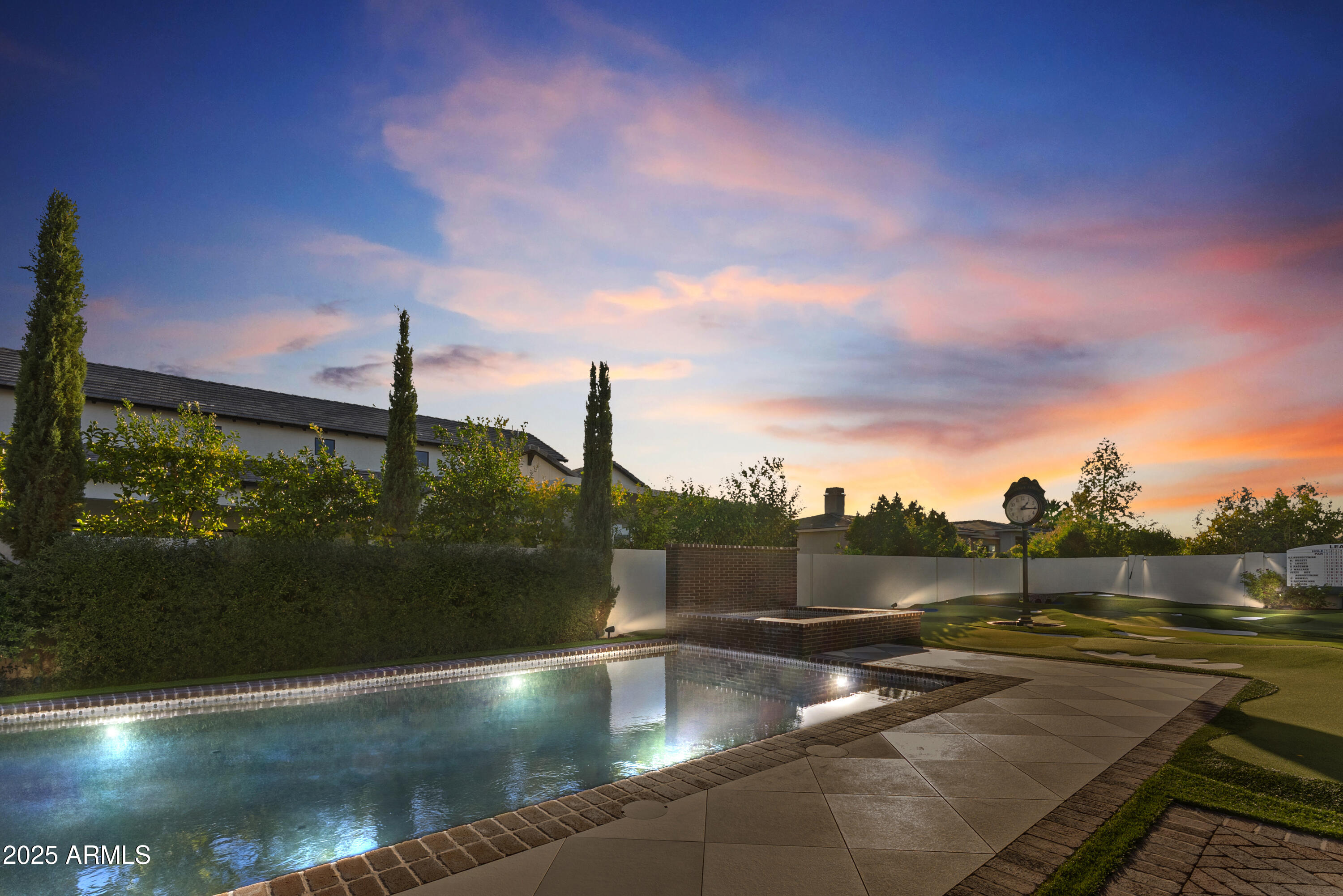 2753 East Hummingbird Way Gilbert, AZ 85297 - Photo 3 of 44 a view of a swimming pool with a patio