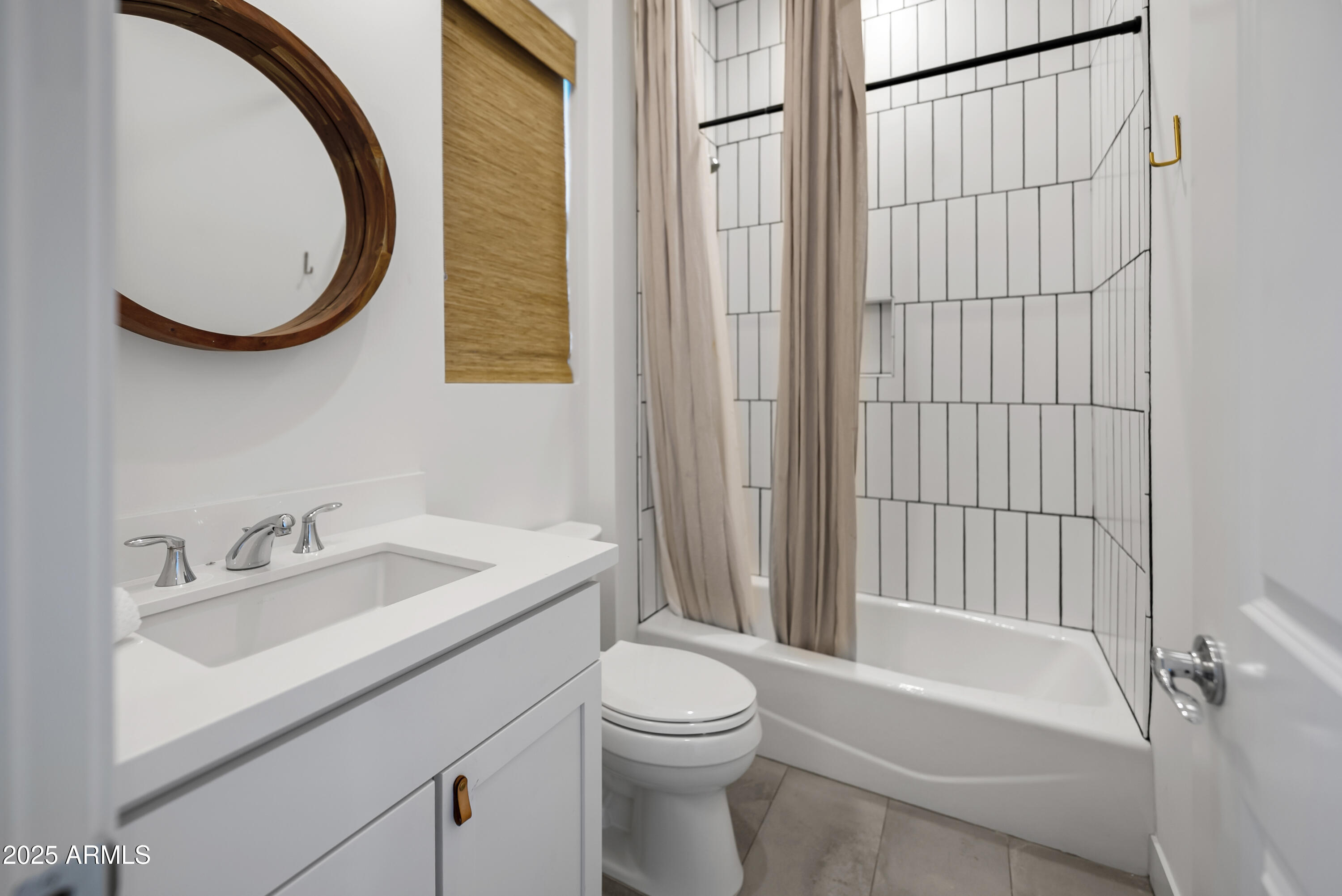 2753 East Hummingbird Way Gilbert, AZ 85297 - Photo 31 of 44 a bathroom with a sink a toilet and a mirror