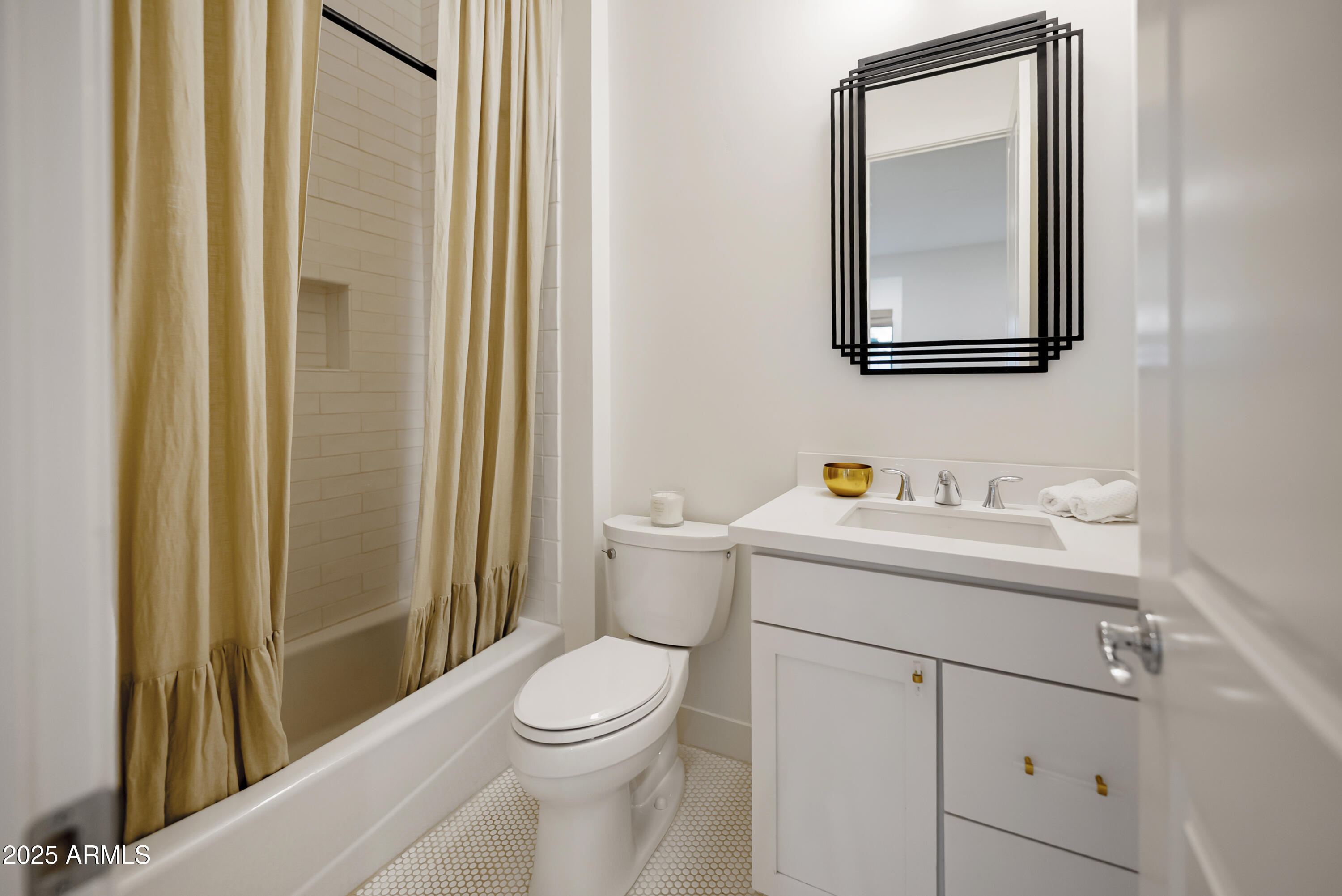 2753 East Hummingbird Way Gilbert, AZ 85297 - Photo 34 of 44 a bathroom with a toilet sink vanity and mirror