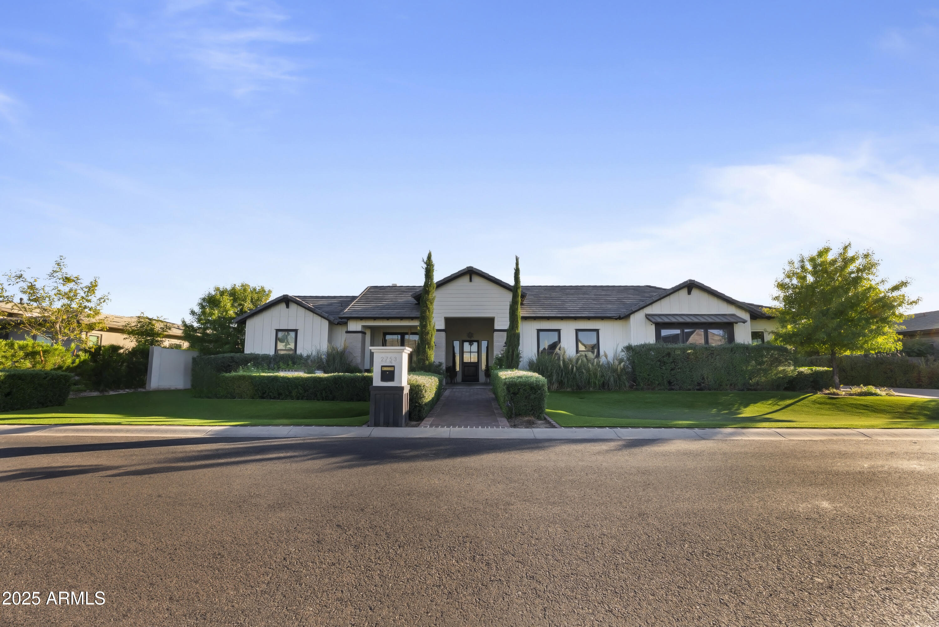 2753 East Hummingbird Way Gilbert, AZ 85297 - Photo 43 of 44 a front view of house with yard and green space