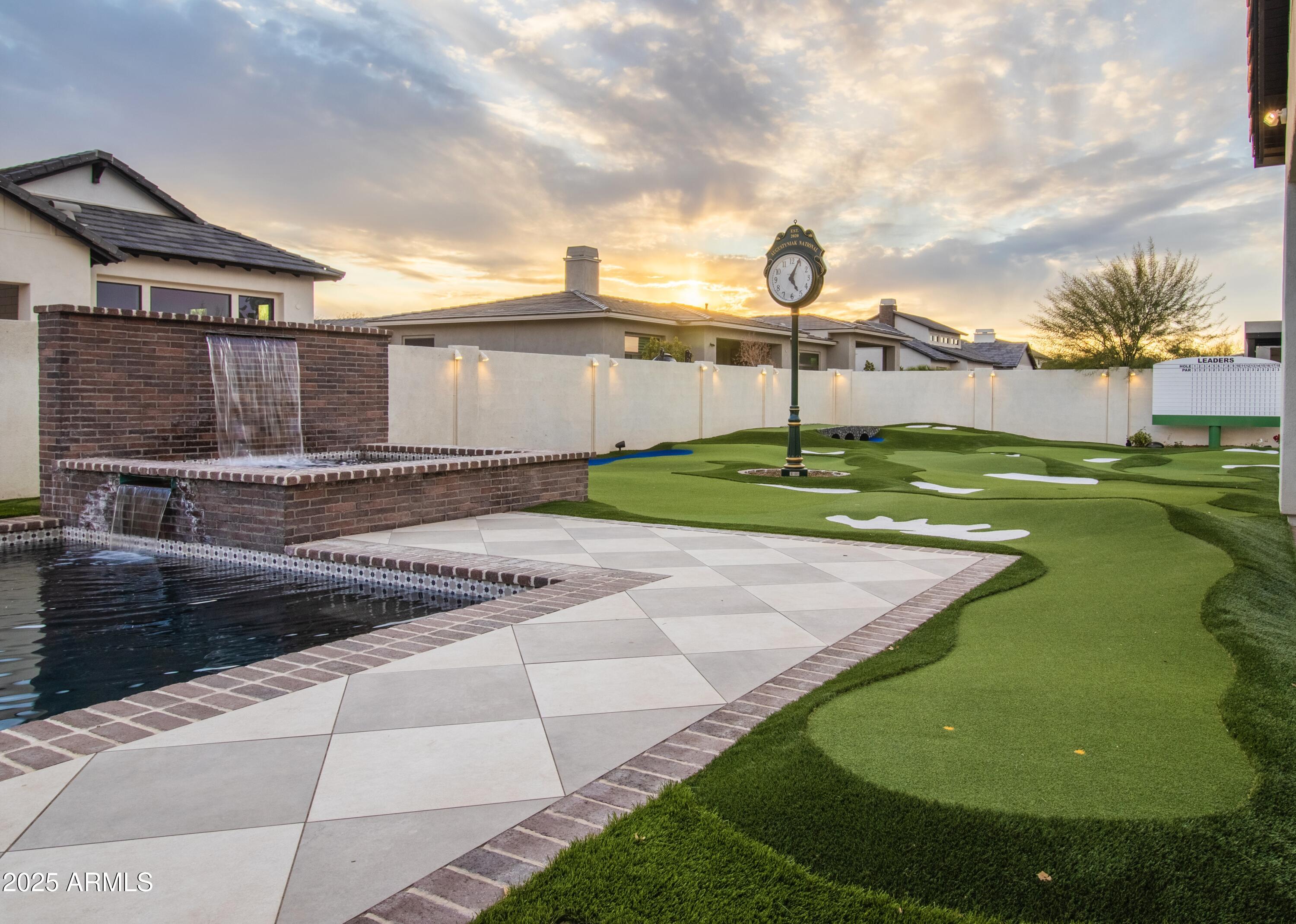 2753 East Hummingbird Way Gilbert, AZ 85297 - Photo 7 of 44 a backyard of a house with table and chairs