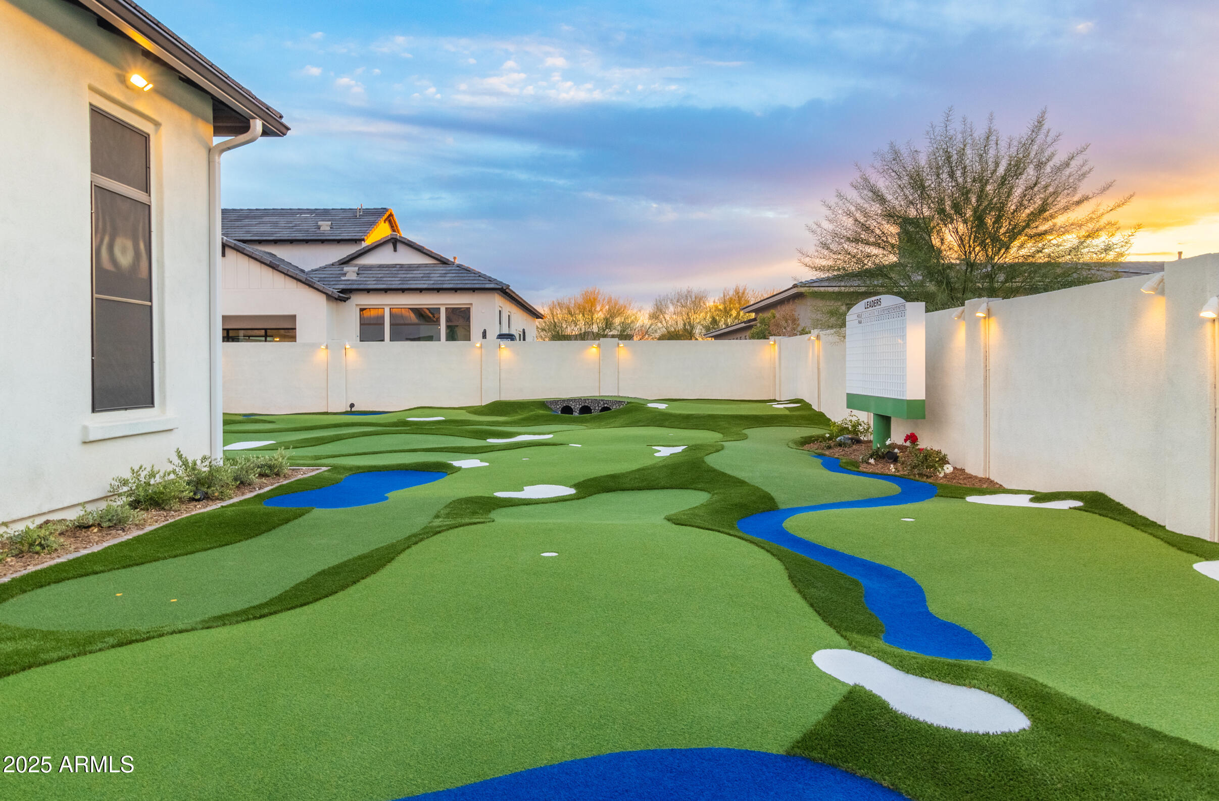 2753 East Hummingbird Way Gilbert, AZ 85297 - Photo 10 of 44 a front view of a house with a yard and garage