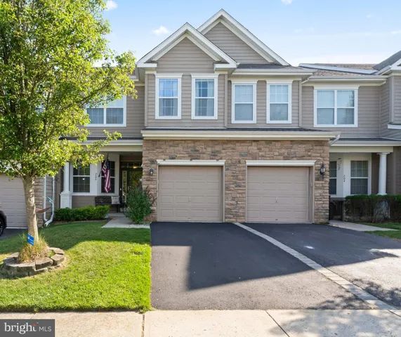 a front view of a house with yard