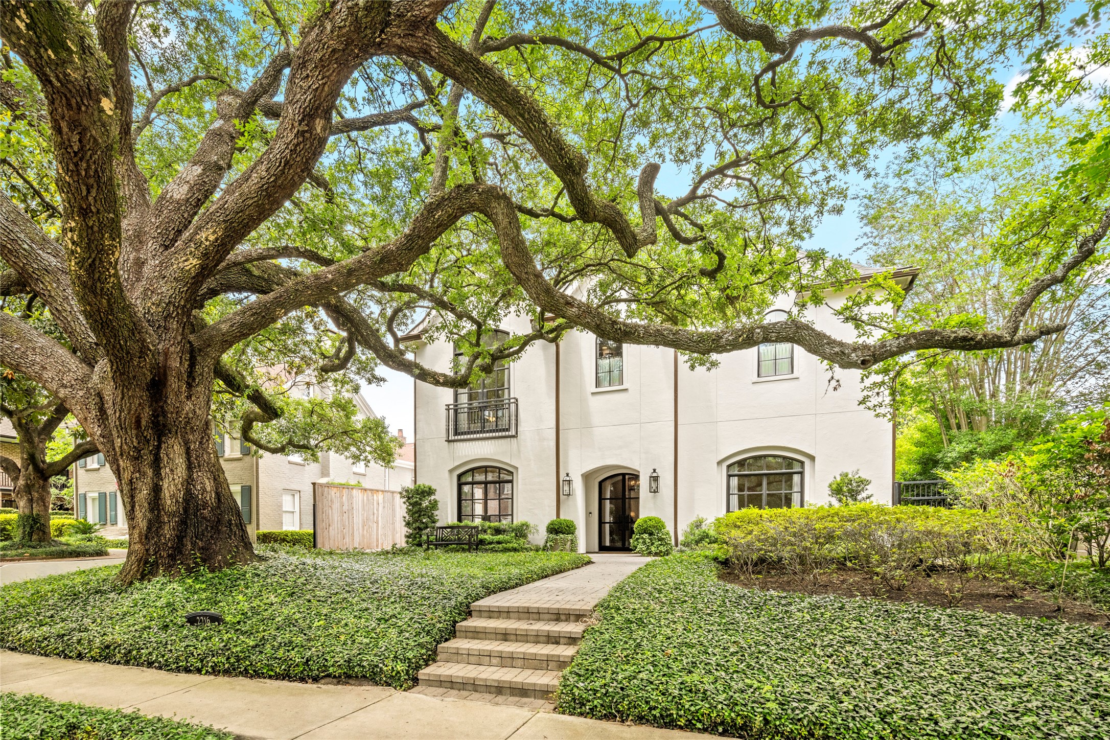 2216 Stanmore Drive Houston, TX 77019 - Photo 46 of 46 a front view of a house with garden