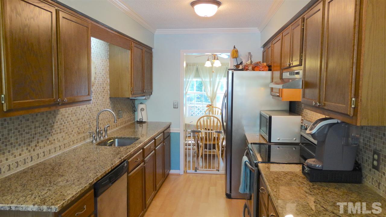 Huge eat-in kitchen with stainless steel, tile, granite! So much counterspace.