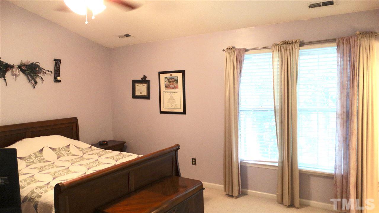 This lovely Master Suite has a vaulted ceiling and walk-in closet and adjoining bath.
