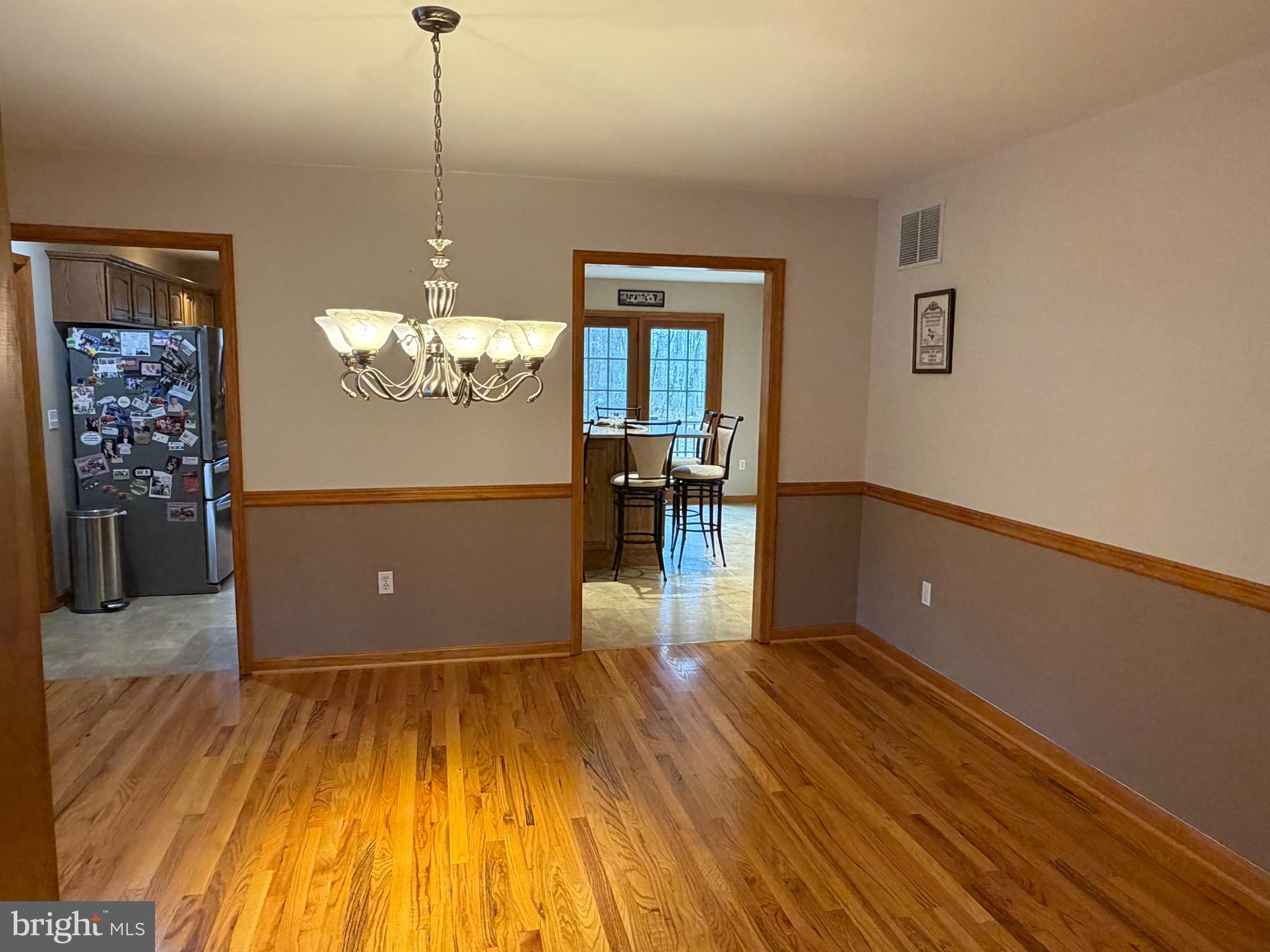 8664 Mitchell Road Denton, MD 21629 - Photo 11 of 22 a view of a room with wooden floor