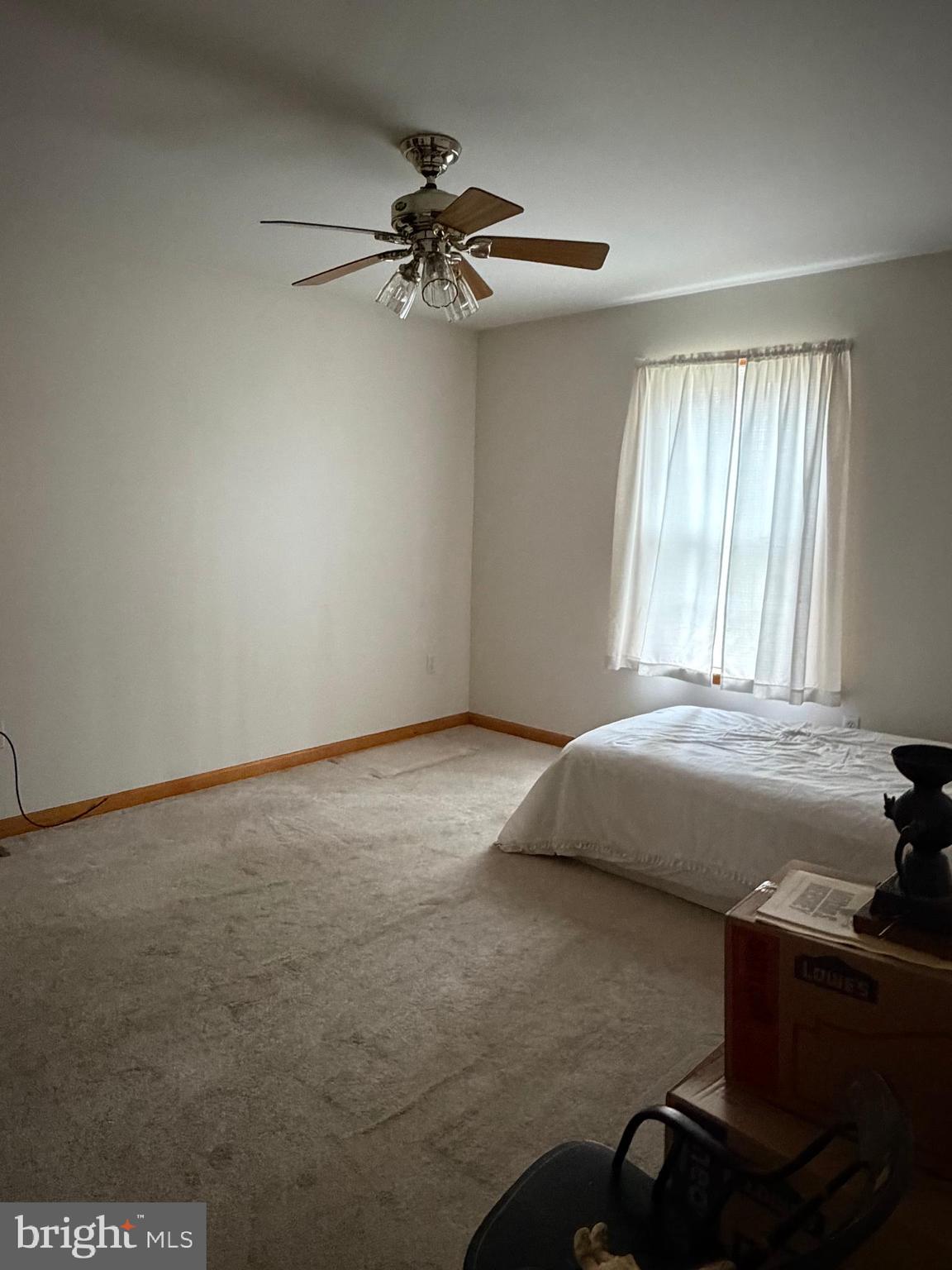 8664 Mitchell Road Denton, MD 21629 - Photo 16 of 22 a room with a bed and a window