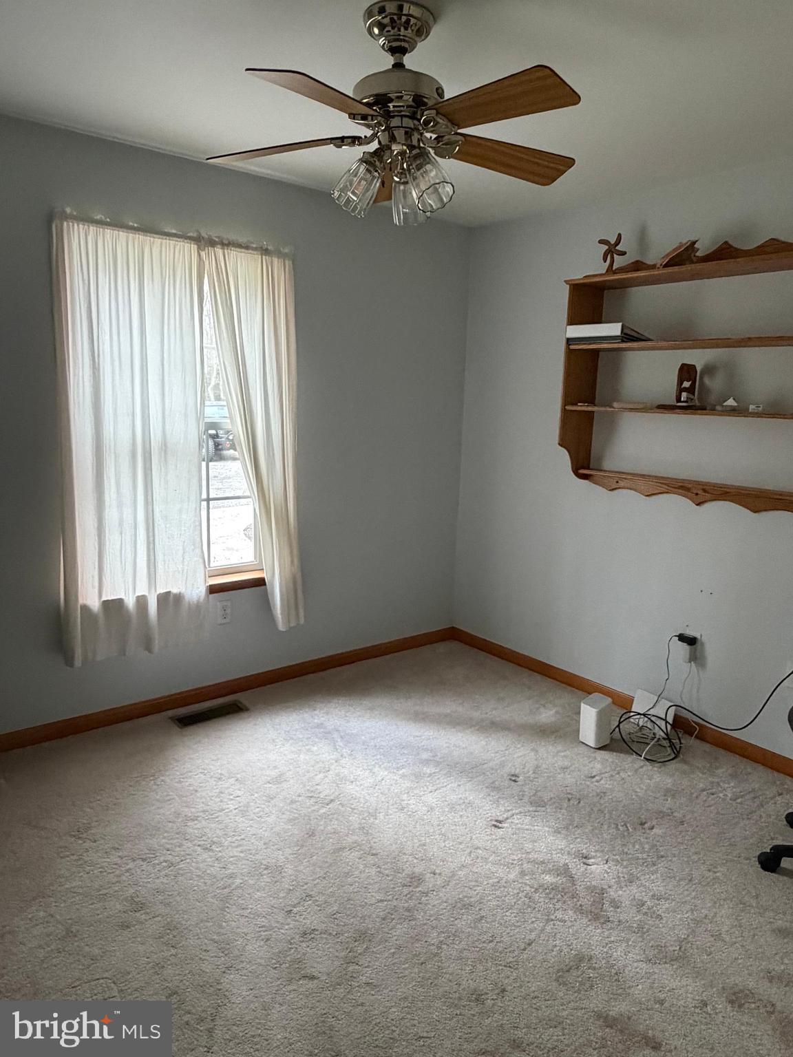 8664 Mitchell Road Denton, MD 21629 - Photo 17 of 22 a view of an empty room with a window