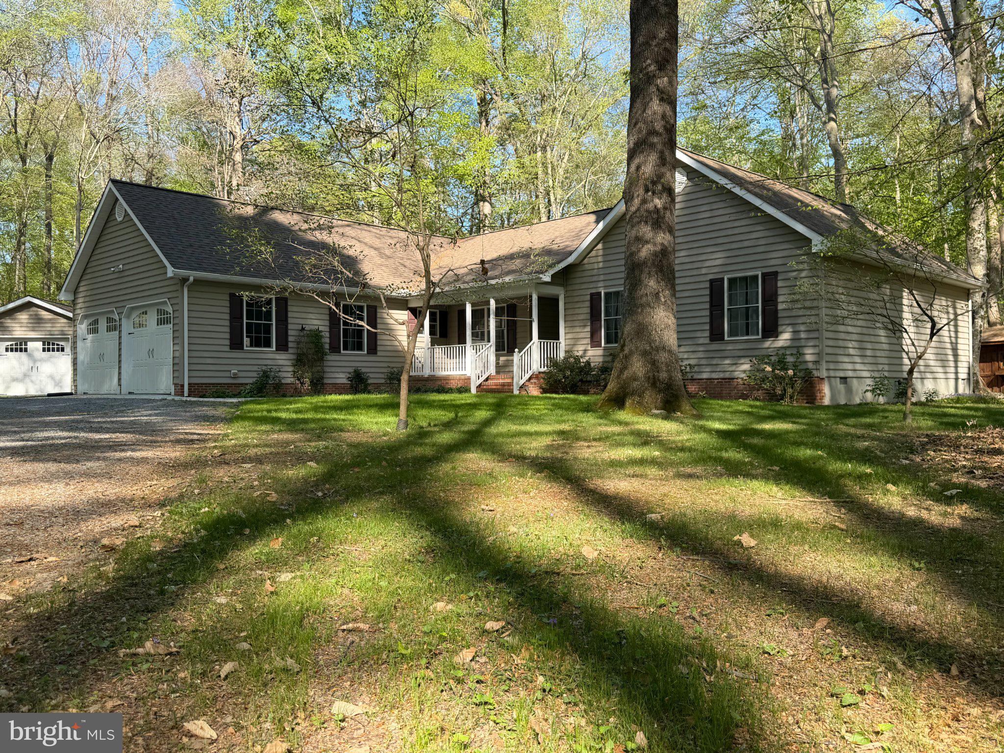 8664 Mitchell Road Denton, MD 21629 - Photo 22 of 22 a front view of house with yard and green space