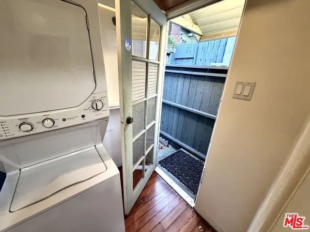 a view of a porch with wooden floor and fence