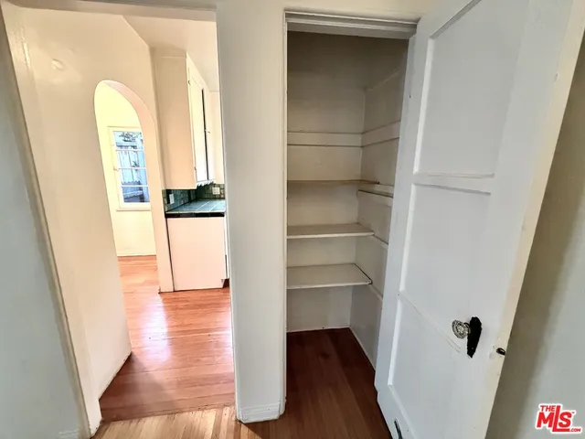 a view of a hallway view with wooden floor and staircase