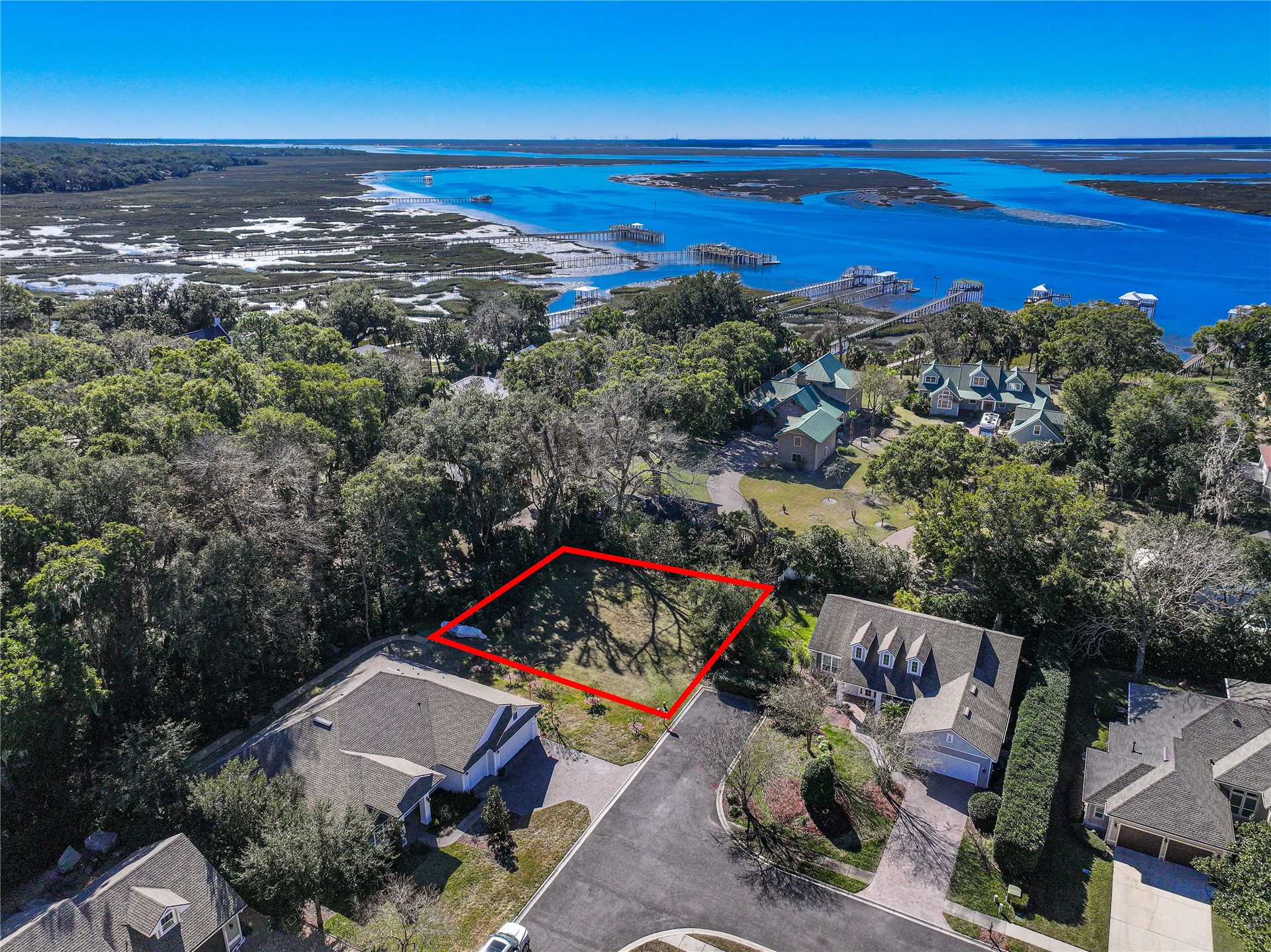 an aerial view of a house with a ocean view