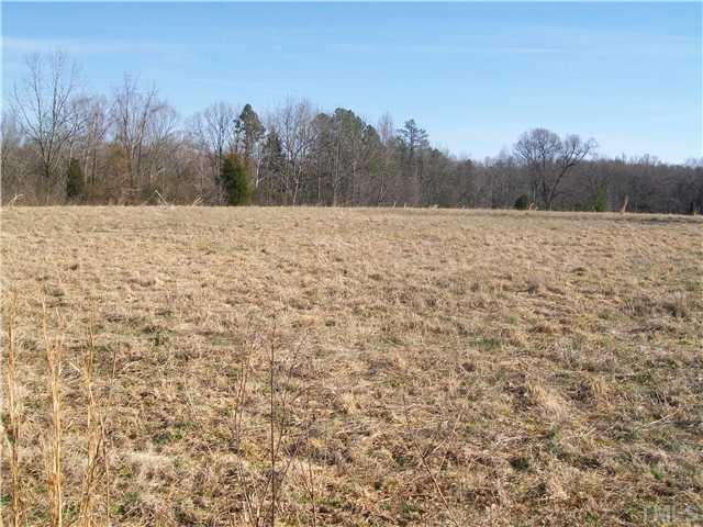 0 Cardens Cove Road, Unit LOT 1 Timberlake, NC 27583 - Photo 3 of 5 a view of a yard with trees in the background