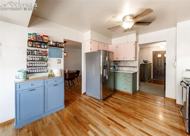 a kitchen with stainless steel appliances a refrigerator and a sink