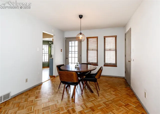 a dining room with furniture and window