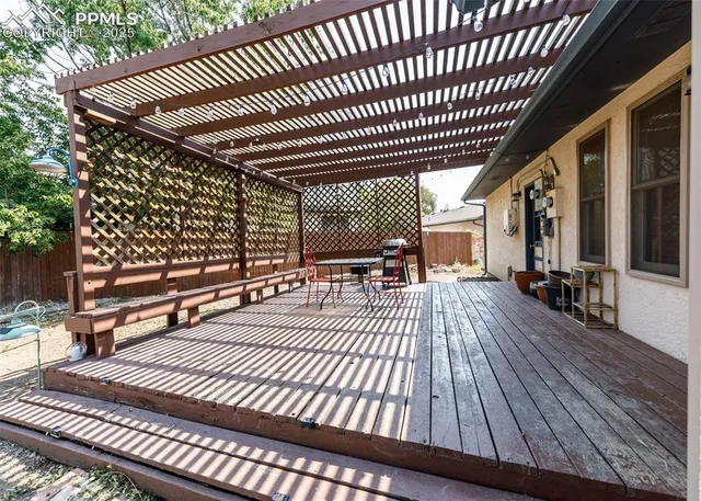 a view of a patio with wooden floor