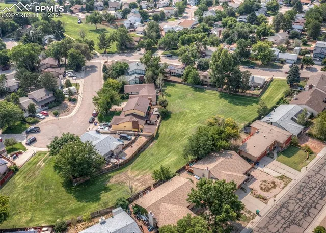 an aerial view of a house with a garden