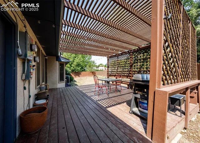 a view of a patio with wooden floor