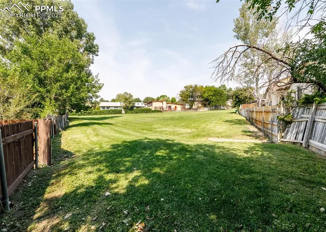 a view of a yard with an outdoor space
