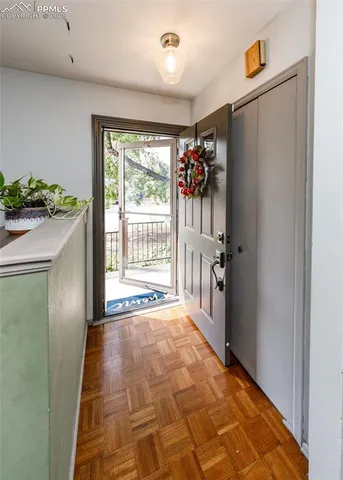 a view of entryway with window and hallway