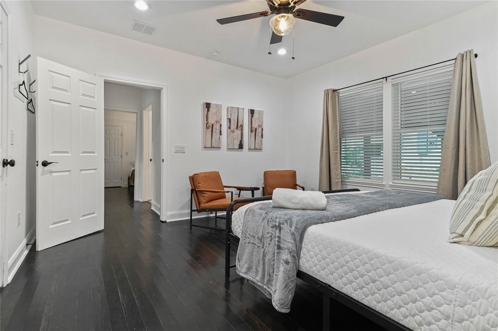 1106 West Chestnut Street Denison, TX 75020 - Photo 22 of 38 Bedroom with dark hardwood / wood-style flooring and ceiling fan