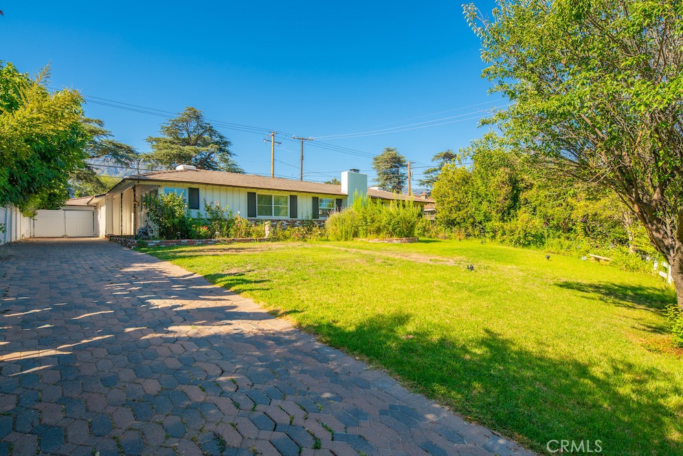 925 Catalpa Road Arcadia, CA 91007 - Photo 1 of 1 a view of an swimming pool with an outdoor space and seating area