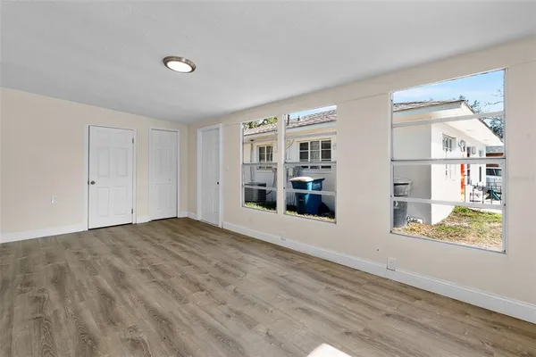 a view of an empty room with a window