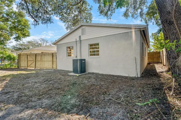 a view of a house with a yard and garage