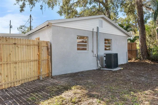 a view of a house with a backyard