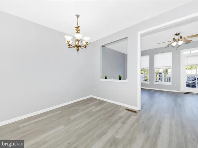 a view of kitchen with cabinets and wooden floor