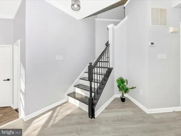 a view of a kitchen with a sink and a window