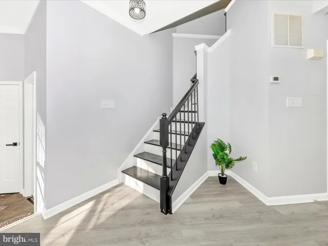 a view of a kitchen with a sink and a window