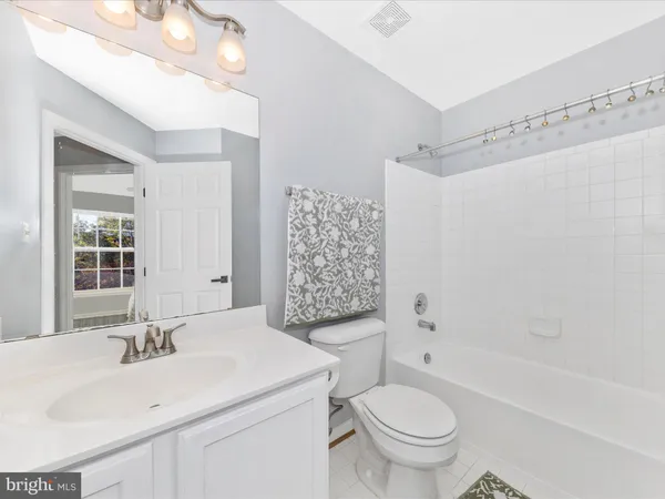 a bathroom with a toilet and a sink