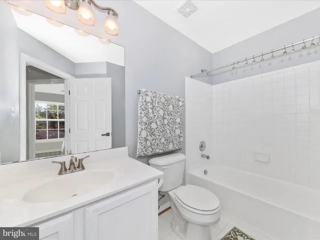 a bathroom with a toilet and a sink