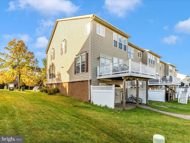 a view of a house with a yard and plants