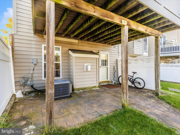 a view of a chair and table on the wooden deck