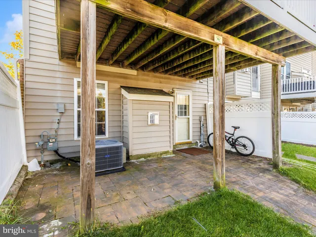 a view of a chair and table on the wooden deck