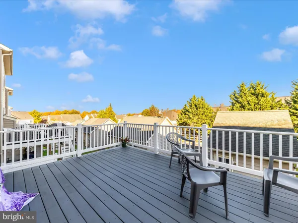 a view of a deck with wooden floor and seating space