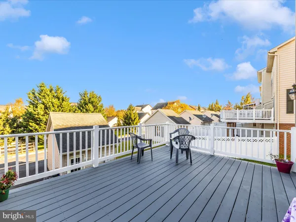 a aerial view of a house with table and chairs and a fire pit