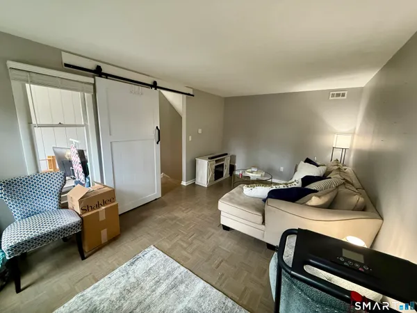 a living room with furniture and a window