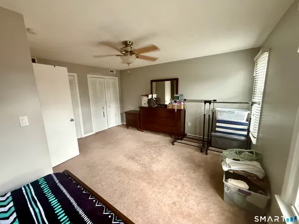 a view of livingroom with furniture and ceiling fan